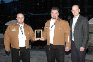 Daniel (left) and Justin Maendel (center) of Rosebank Colony in Miami, Man. With Dr. Ben Willing, University of Alberta.